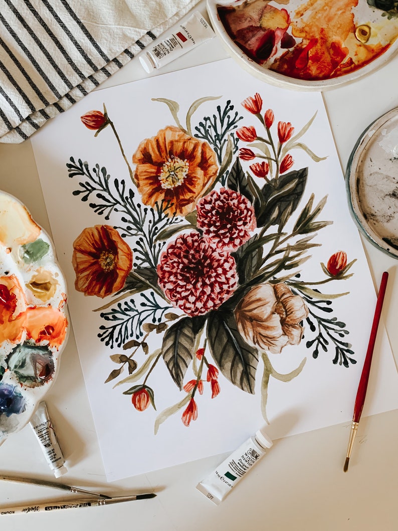 May include: A watercolour painting of a bouquet of flowers in shades of red, orange, and brown. The flowers are arranged in a loose, natural style, and the painting is set against a white background.