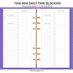 May include: A purple personal size time-blocking planner with the text "TIME BOX DAILY TIME BLOCKING" and "Personal Size 3.75 x 6.75 in." The planner has sections for daily blocks, top priorities, and a brain dump. The planner is open, showing the inside pages.