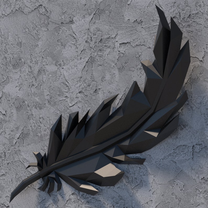 May include: A black geometric feather sculpture with a textured surface. The sculpture is made of many small triangles and is reminiscent of a bird's feather.