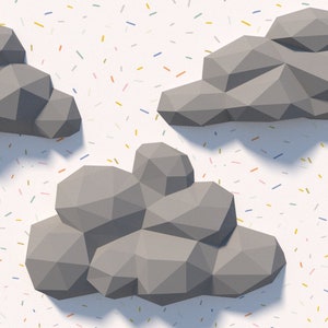 May include: Three grey, geometric, origami-style clouds against a white background with a confetti-like pattern of colourful lines.