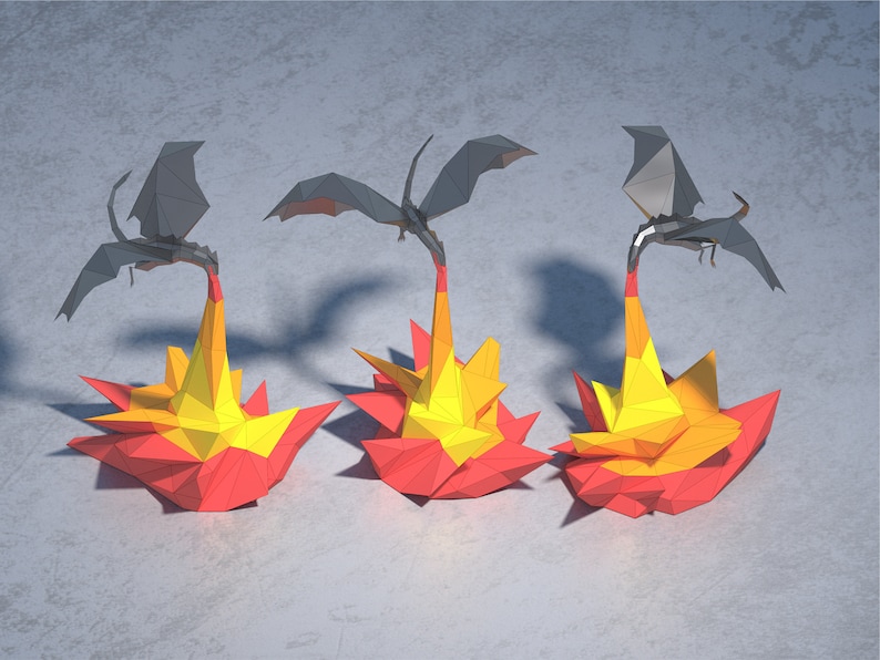 May include: Three origami dragons made of paper, each with black wings and a red, yellow, and orange fire base.
