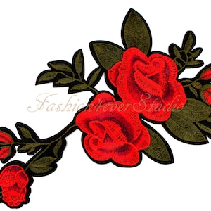 May include: Red embroidered rose flower patch with green leaves and stems. The patch is ideal for adding a touch of elegance to clothing, bags, or other accessories.
