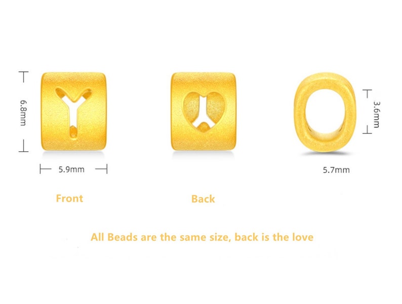 May include: Three gold-colored beads with different designs. The first bead has a letter Y cut out of it. The second bead has a heart cut out of it. The third bead is a circle with a hole in the center. Each bead is approximately 0.6 inches tall and 0.6 inches wide.