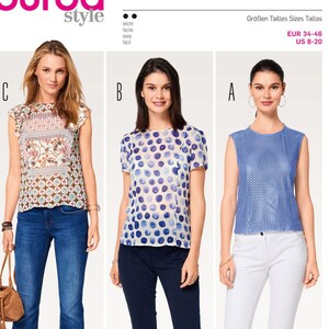 May include: A Burda Style sewing pattern envelope for top 6525, featuring three variations: a floral print sleeveless top with ruffled shoulders, a blue polka dot short-sleeve top, and a blue sleeveless top with a textured, perforated fabric finish.