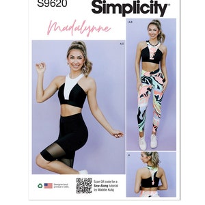 May include: Simplicity sewing pattern S9620 featuring Madalynne designs. The pattern includes a sports bra and leggings. The sports bra is black and white. The leggings have a colorful abstract pattern. The text "Designed and printed in USA" is visible.
