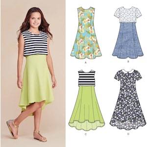 May include: Simplicity pattern 8065 features a young girl wearing a sleeveless dress with a striped top and a lime green skirt. The pattern includes illustrations of other dress designs with floral and patterned tops and skirts. The text "Simplicity" is in the upper right corner.