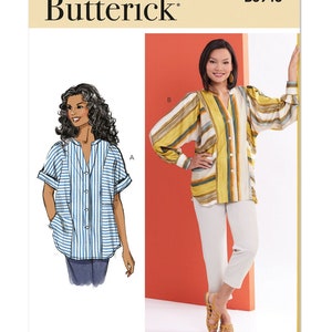 May include: A sewing pattern for a women's blouse with two different sleeve styles. The pattern is from Butterick and has the number B6943 printed on it. The illustration shows a blue and white striped blouse with short sleeves and a yellow and brown striped blouse with long sleeves.