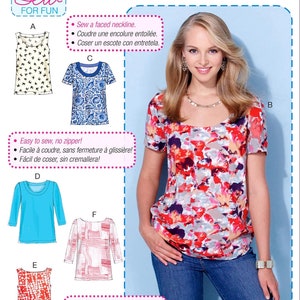 May include: McCall's M7322 sewing pattern for beginner tops. The image shows a woman wearing a colorful floral print top. The pattern includes various top styles, including a tank top, short-sleeve, and long-sleeve options.