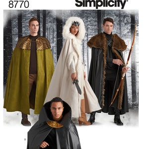 May include: Simplicity sewing pattern number 8770 for making four different styles of cloaks. The cloaks are shown on four models, each wearing a different cloak. The cloaks are all long and flowing, and they have different colors and designs. The cloaks are made of different fabrics, including velvet, faux fur, and leather.