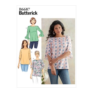 May include: A sewing pattern for a women's top with a boat neck and 3/4 sleeves. The pattern is from Butterick and has the number B6687 on it. The top is shown in three different fabric patterns: green with white polka dots, yellow with white polka dots, and floral.