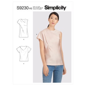 May include: A woman wearing a light pink, one-sleeve top with a draped design. The image also shows line drawings of two other top styles. The Simplicity logo and pattern number S9230 are visible.