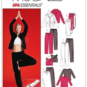 May include: McCall's Spa Essentials sewing pattern envelope featuring illustrations of a zip-up hoodie, drawstring pants, a tank top, a long-sleeve shirt, a skirt, and a yoga mat bag. The cover displays a person in black activewear on a red background.