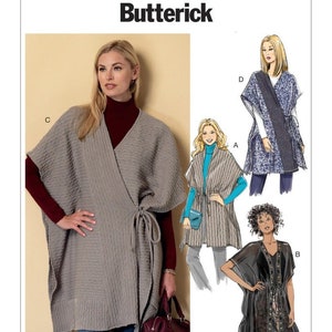 May include: Butterick sewing pattern B6392 featuring four variations of a wrap-style poncho or tunic. The pattern includes illustrations of three different designs labeled A, B, and D, alongside a photograph of design C in a textured gray knit.