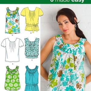 May include: Simplicity 2892 sewing pattern for tops featuring six variations. The designs include sleeveless blouses with gathered necklines and short-sleeved shirts with waist ties, shown in various floral, polka dot, and solid fabric prints.