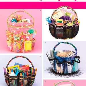 May include: A Simplicity 4232 sewing pattern sheet displaying five variations of a round fabric organizer basket with multiple exterior pockets and a handle. The designs feature different fabric patterns, colors, and trims, filled with various craft supplies.
