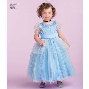 May include: A young girl wearing a light blue princess costume with a tulle skirt and a crown. The costume has a satin bodice with a floral pattern and a black choker.