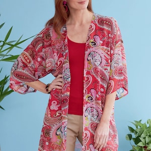 May include: A red and pink paisley patterned kimono with a long, flowing silhouette. The kimono has a three-quarter sleeve and is made of a lightweight, sheer fabric.