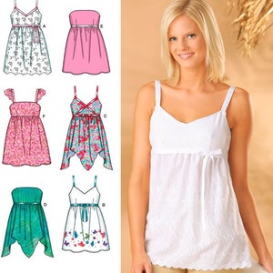 May include: Simplicity 4127 sewing pattern for six variations of a sleeveless top or dress. The illustrations show various necklines, strap styles, and hem shapes, including solid colors and floral prints. A white eyelet top is featured on the cover.