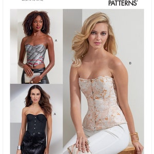 May include: Vogue Patterns V1876. The image displays three strapless corset tops. One is black, another is a patterned silver and red, and the third is cream with a floral design. The Vogue Patterns logo is visible. The size is B5 (8-10-12-14-16).