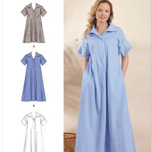 May include: Simplicity sewing pattern S3130. The image shows a woman wearing a blue and white striped dress. The pattern includes illustrations of three different dress styles. The text "Designed and printed in USA" is also visible.