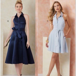 May include: Vogue Patterns dressmaking pattern showing two halter-neck dresses. One is navy blue with a bow, the other is light blue with a tie belt. The Vogue Patterns logo is at the top.