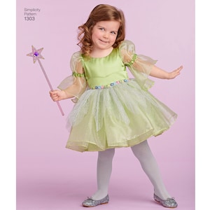 May include: A young girl wearing a green fairy costume with a tulle skirt and sheer sleeves. She is holding a pink and purple star-shaped wand. Simplicity Pattern 1303.