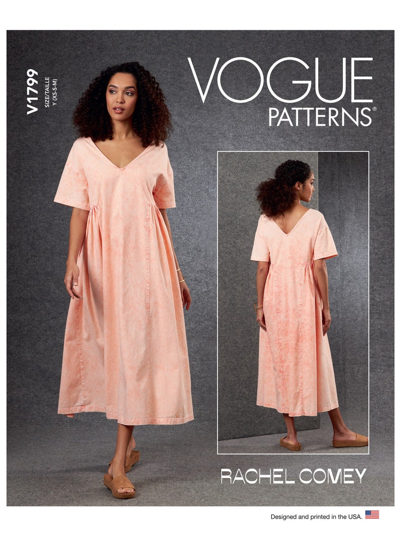 May include: A peach-colored dress with a V-neck and short sleeves. The dress has a gathered waist and a midi length. The Vogue Patterns logo and the name Rachel Comey are visible. The pattern is designed and printed in the USA.