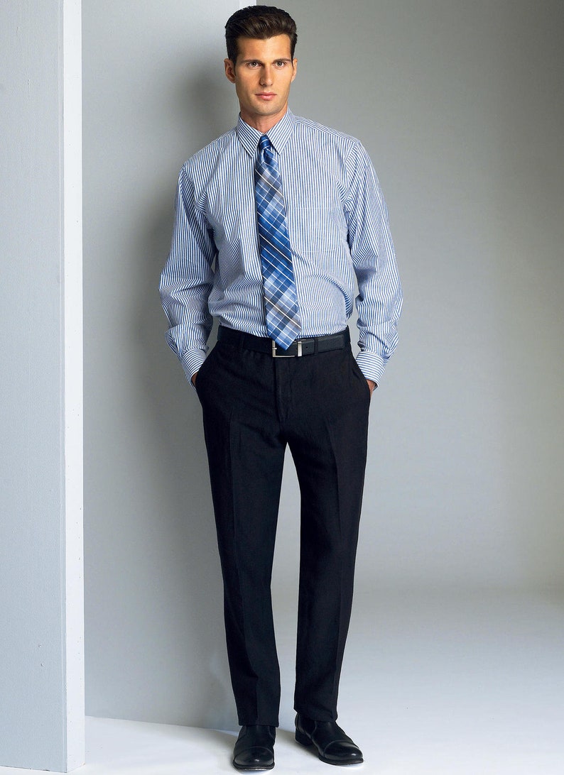 May include: A man wearing a blue and white striped dress shirt with a blue and black patterned tie. He is wearing black pants and black shoes.