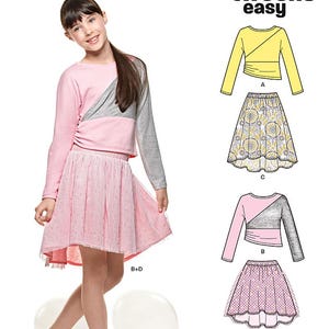 May include: A pink and gray long-sleeved top and a pink skirt. The top has a color block design with a gray panel. The skirt is a light pink tulle with a dotted pattern. The image also shows a sewing pattern for tweens.