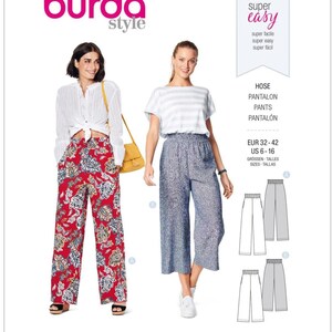 May include: A Burda Style sewing pattern, number 6229, featuring two women modeling pants. One woman wears red floral pants, the other wears blue patterned pants. The pattern includes size information in US sizes 6-16.