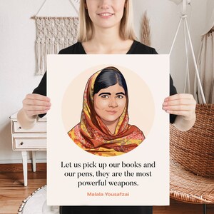 May include: A motivational quote by Malala Yousafzai, a young Pakistani activist for female education, is featured on a poster. The quote reads: "Let us pick up our books and our pens, they are the most powerful weapons." The poster features a cartoon illustration of Malala Yousafzai wearing a headscarf.