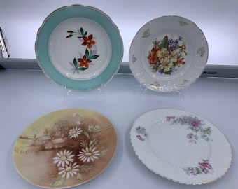 Unmarked Floral plates Choose From: Teal Border w/Red Floral, Pink/White Floral, Orange/Yellow/Blue Floral, or Daisy Floral w/Church