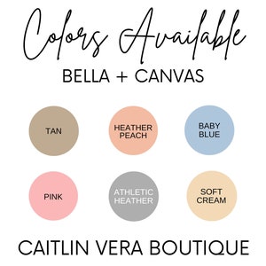 May include: A colour chart showing the available colours for Bella + Canvas apparel. The colours include tan, heather peach, baby blue, pink, athletic heather, and soft cream. The text "CAITLIN VERA BOUTIQUE" is at the bottom of the chart.