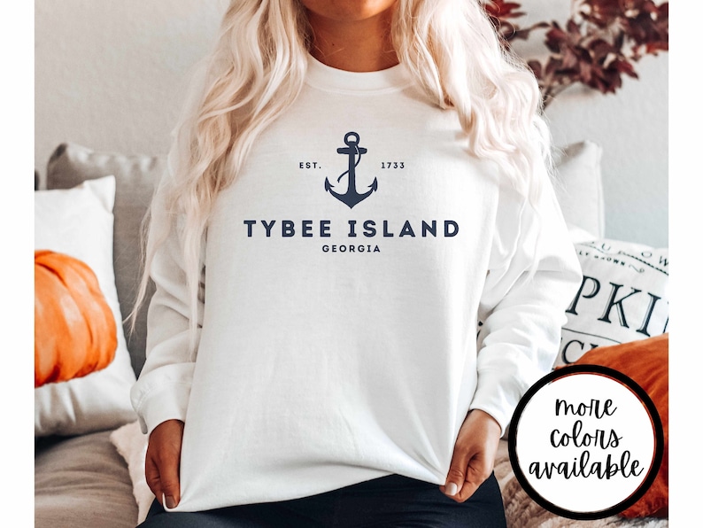 May include: White sweatshirt with a navy blue anchor and the text "Tybee Island, Georgia, Est. 1733".