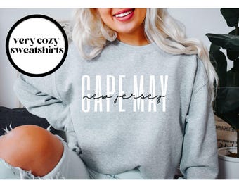 May include: Gray sweatshirt with the text "CAPE MAY NEW JERSEY" printed on the front.