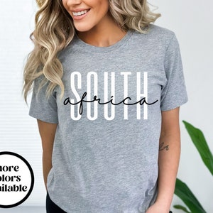 May include: Grey t-shirt with the text "SOUTH africa" printed in white.