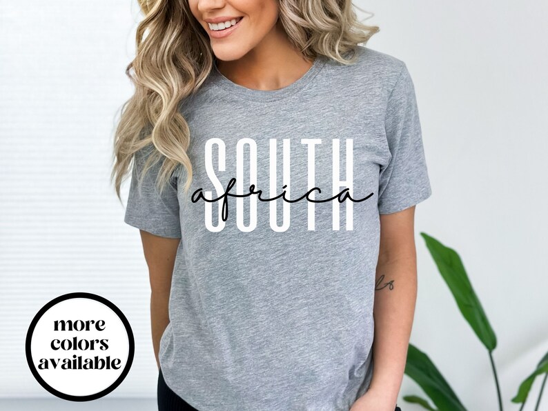 May include: Grey t-shirt with the text "SOUTH africa" printed in white.