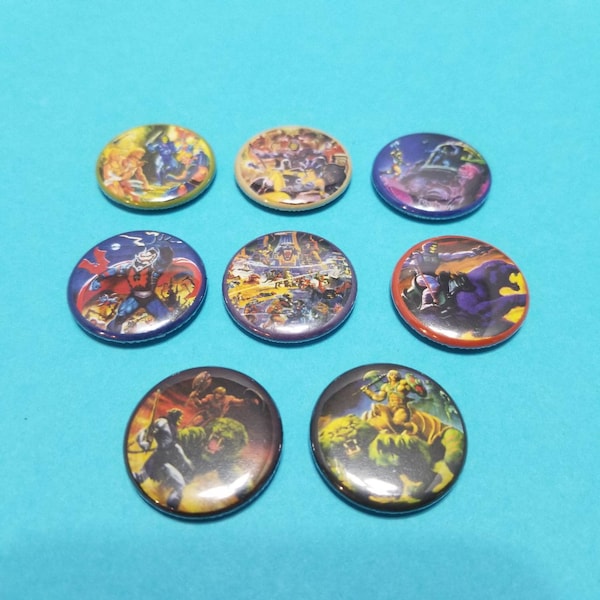 He-Man and the Masters of the Universe! Set of 8 pin back buttons badges pins featuring amazing artwork from the 80s toys packaging! Motu