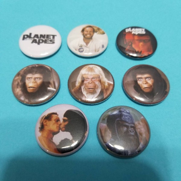 Planet of the Apes! Set of 8 pin back buttons badges featuring images from the classic scifi movie! 70s 80s vintage retro action