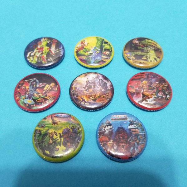 He-Man and the Masters of the Universe! Set of 8 pin back buttons badges pins featuring the packaging artwork from the 80s toys! Motu