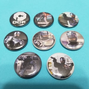 Robocop! Set of 8 pin back buttons badges pins featuring robocop from the classic 80s action movie! Retro vintage scifi