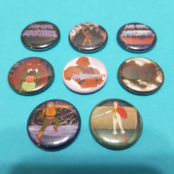 He-Man and the Masters of the Universe! Set of 8 pin back buttons badges pins featuring images from the classic 80s cartoon series! Motu