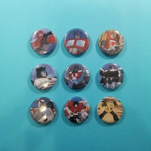 Robots in disguise! Set of 9 Transformers refrigerator magnets featuring Autobots from the 80s cartoon. Vintage toys retro one inch magnets
