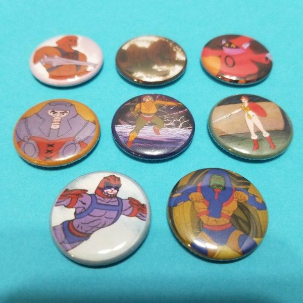 He-Man and the Masters of the Universe! Set of 8 pin back buttons badges pins featuring the heroic warriors from the 80s cartoon! Motu