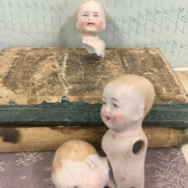 DH#7 - Vintage German doll head/broken torso of "Young Boy" approx. 2 - 2 1/2". bisque, painted face. 1 doll 12.00