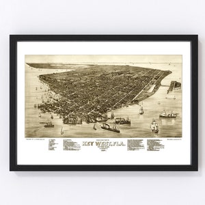 May include: An antique map of Key West, Florida, showing the city's layout and surrounding waters. The map is in sepia tones and features a detailed view of the city's streets, buildings, and harbor. The text "KEY WEST, FLA." is prominently displayed at the bottom of the map.