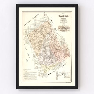 May include: An antique map of Comanche County, Texas, showing the county's townships, roads, and railroads. The map is printed in black and white with some color accents. The map is framed in a black frame.