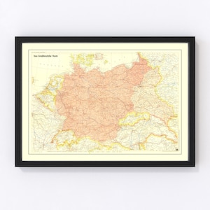 May include: A vintage map of the "Grossdeutsche Reich" (Greater German Reich) with a peach-colored outline of Germany and its borders. The map is framed in black and has a white background.
