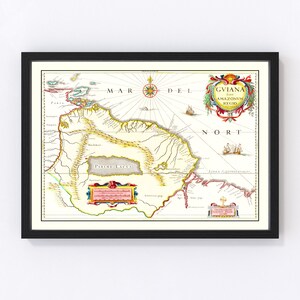 May include: An antique map of Guiana, also known as the Amazon region, with a compass rose and a decorative cartouche. The map is printed on a cream-colored background with yellow, red, and blue accents. The text "GVIANA, five AMAZONVM REGIO" is printed in the upper right corner.