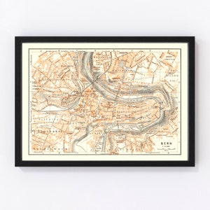 May include: An antique map of Bern, Switzerland, printed in black, brown, and orange ink. The map shows the city's streets, buildings, and landmarks, including the Aare River. The map is titled "Bern 1:12,000" and is dated 1900.